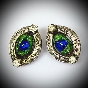 Vintage clip on earring featuring peacock eye foiled glass cabochons.